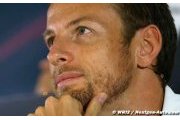 Button resorts to jokes as McLaren wait continues