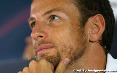 Button resorts to jokes as McLaren wait continues