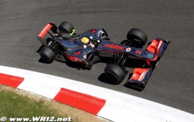 Alonso, Button smiling on Monza front row