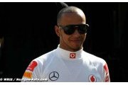 Hamilton raises eyebrows with 'garish' outfits