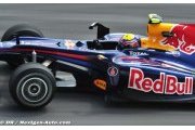 Webber takes pole at wet Sepang