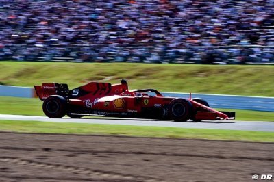 Vettel on pole in Japan as Ferrari lock out front row