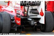 Ferrari engineer working on diffuser for F10B car