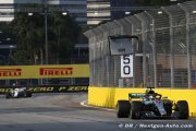 Hamilton powers to 'magical' pole in Singapore