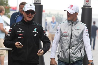 Rosberg says father urged him to flee Schumacher