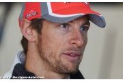 Amid Ferrari rumblings, Button commits to McLaren
