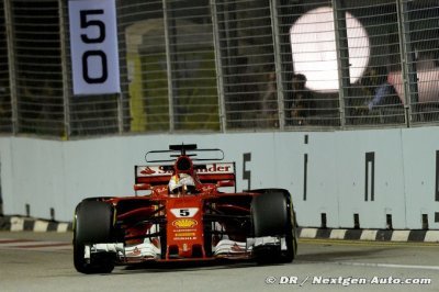 Vettel storms to Singapore pole ahead of Red Bulls