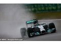 Rosberg takes pole at wet Spa