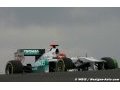 Schumacher fastest in rain-affected opening practice