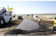 Austin : la première couche d'asphalte est posée