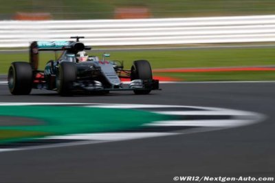Hamilton wins British GP as Rosberg faces radio message investigation