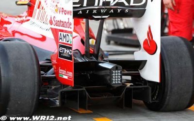 Ferrari engineer working on diffuser for F10B car