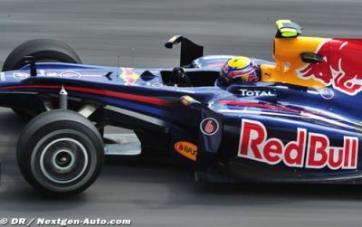 Webber takes pole at wet Sepang